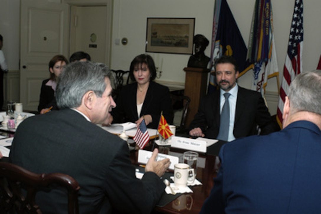 Deputy Secretary of Defense Paul Wolfowitz (left) conducts a meeting in the Pentagon with Prime Minister Branko Crvenkovski (facing right) of the Former Yugoslav Republic of Macedonia on Nov. 25, 2003. Accompanying Crvenkovski is Minister of Foreign Affairs Ilena Mitreva (center). The leaders are meeting to discuss defense issues of mutual interest. 