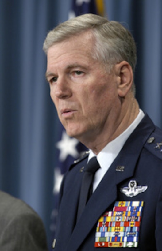 Chairman of the Joint Chiefs of Staff Gen. Richard B. Myers, U.S. Air Force, listens to a reporter's question during a press conference with Secretary of Defense Donald H. Rumsfeld in the Pentagon on Nov. 25, 2003. Myers and Rumsfeld gave opening statements then fielded a broad range of questions from reporters. 