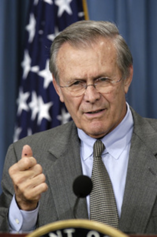 Secretary of Defense Donald H. Rumsfeld discusses an Iraqi issue with reporters during a press briefing with Chairman of the Joint Chiefs of Staff Gen. Richard B. Myers, U.S. Air Force, in the Pentagon on Nov. 25, 2003. Rumsfeld and Myers gave opening statements then fielded a broad range of questions from reporters. 