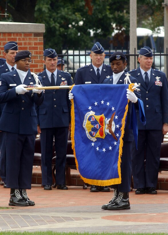 SCOTT AIR FORCE BASE, Ill. -- Airman 1st Class Leonard McCall and Staff Sgt. Anthony Nixon unfurl the 18th Air Force flag during the reactivation ceremony here Oct. 1.  They are part of the Air Mobility Command Elite Guard.  (U.S. Air Force photo by Master Sgt. Anthony Lambert)