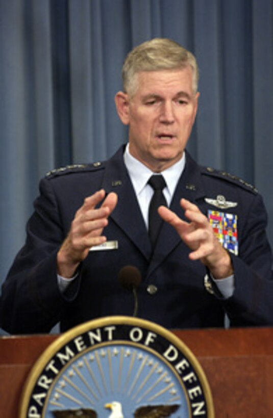 Chairman of the Joint Chiefs of Staff Gen. Richard B. Myers, U.S. Air Force, gestures to make his point as he responds to a reporter's question during a Pentagon press briefing on Oct. 2, 2003. Myers and Secretary of Defense Donald H. Rumsfeld gave reporters an operational update on Operation Iraqi Freedom. 