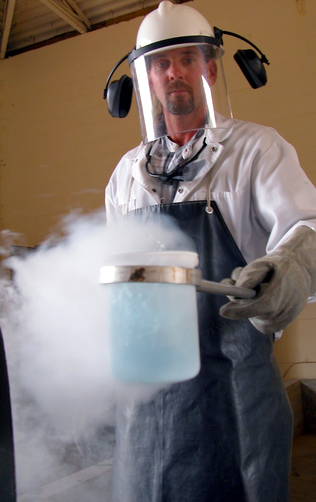 ROBINS AIR FORCE BASE, Ga. -- Billy Arnett collects a sample of liquid oxygen to test for odor and contamination.  Arnett is a fuels specialist with the 78th Logistics Readiness Squadron's LOX station here.  (U.S. Air Force photo by Sue Sapp)