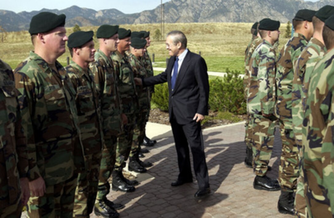 Secretary of Defense Donald H. Rumsfeld goes into the ranks to thank the soldiers from the 10th Special Forces Group at Fort Carson, Colo., on Oct. 7, 2003. Rumsfeld is visiting area commands prior to hosting the 2003 NATO informal defense ministers' meeting in Colorado Springs on October 8th and 9th. 
