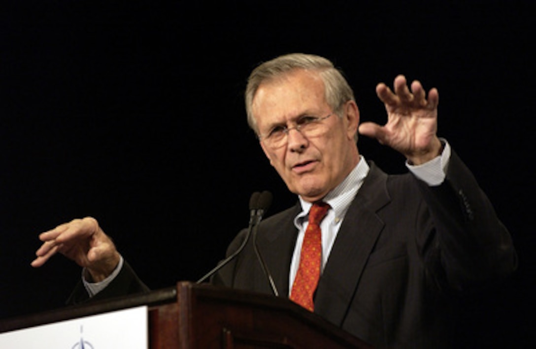 Secretary of Defense Donald H. Rumsfeld answers questions from members of the media during a joint news conference with NATO Secretary General Lord George Robertson in Colorado Springs, Colo., on Oct. 8, 2003. Rumsfeld and Robertson met with the international press after a meeting of NATO Defense Ministers. Rumsfeld is the host for the informal meetings on October 8th and 9th. 