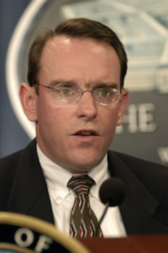 Assistant Secretary of the Navy for Research, Development, and Acquisition John Young briefs reporters at the Pentagon on Oct. 9, 2003, on proposed changes to Navy maintenance schedules regarding the refueling of the nuclear-powered aircraft carrier Carl Vinson (CVN 70). 