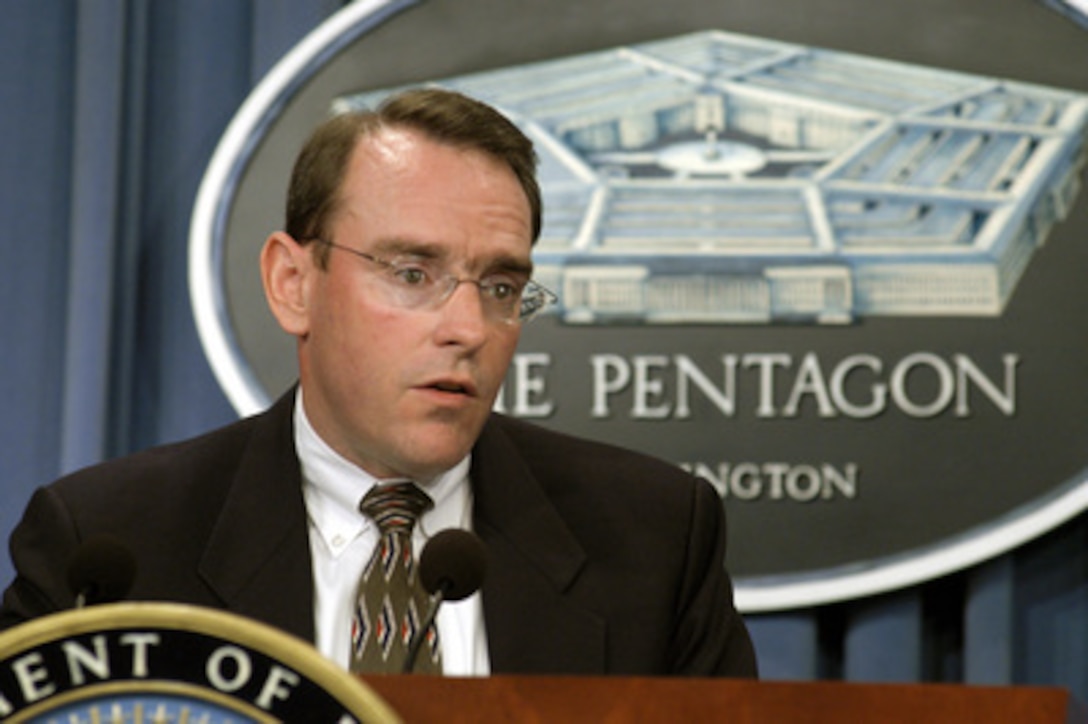 Assistant Secretary of the Navy for Research, Development, and Acquisition John Young briefs reporters at the Pentagon on Oct. 9, 2003, on proposed changes to Navy maintenance schedules regarding the refueling of the nuclear-powered aircraft carrier Carl Vinson (CVN 70). 