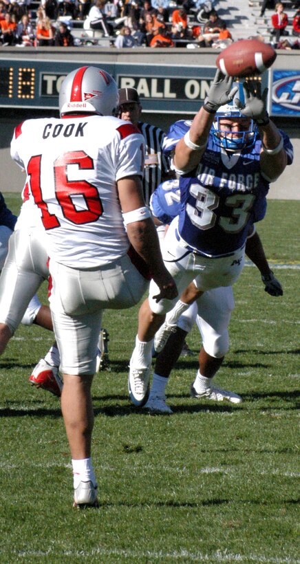 U.S. AIR FORCE ACADEMY, Colo. -- U.S. Air Force Academy's Kris Holstege nearly gets his hands on a punt from the University of Nevada, Las Vegas, punter during the Falcons win Oct. 11, 24-7.  (U.S. Air Force photo by Airman 1st Class Mike Meares)