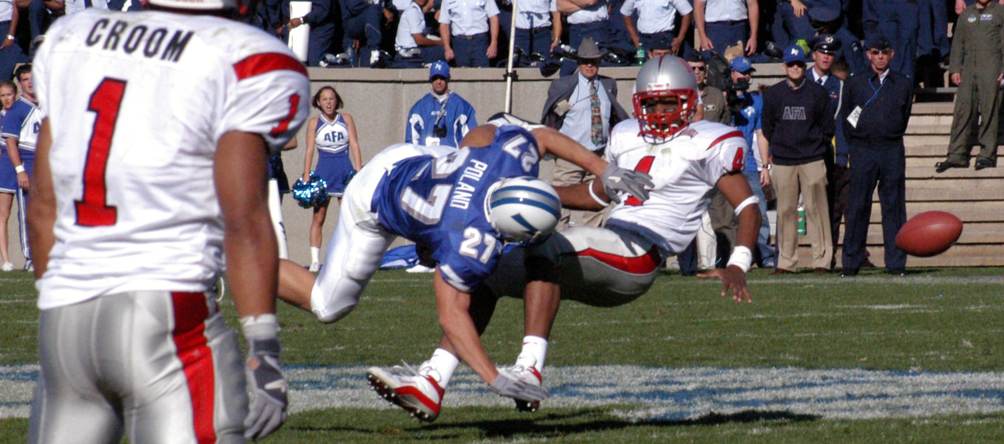 U.S. AIR FORCE ACADEMY, Colo. -- U.S. Air Force Academy defensive back Dennis Poland drills a University of Nevada, Las Vegas, receiver as he attempts to make a catch across the middle of the field.  Poland and the rest of the Falcon defense knocked the wind out of the UNLV passing game holding them to 250 total yards.  (U.S. Air Force photo by Airman 1st Class Mike Meares)