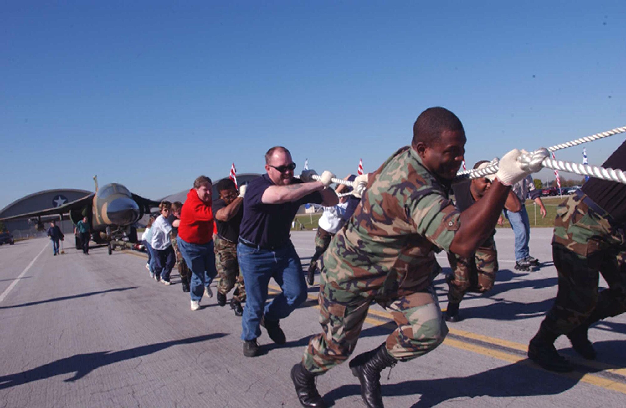 DAYTON, Ohio -- Teams drag a 60,000-pound F-111F fighter jet during the Air Force Museum's fifth annual aircraft pull recently, to see which team can pull it the farthest in 45 seconds.  Twenty-four teams participated, raising nearly $5,000 in Combined Federal Campaign donations.  (U.S. Air Force photo by Jan Lawrence)