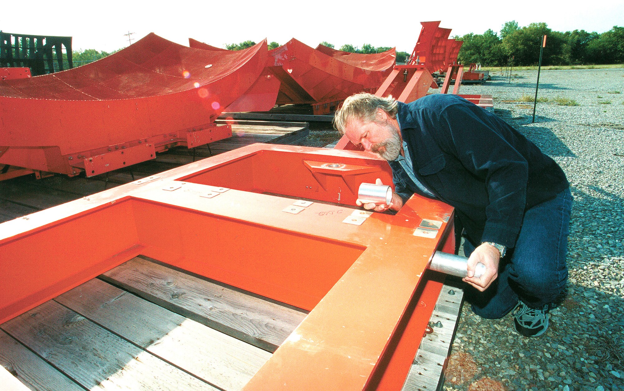 TINKER AIR FORCE BASE, Okla. -- Vern Shurrum demonstrates his idea to have depot-level maintenance on air traffic control radar antennas performed on-site by installing a self-lubricating bushing.  The idea will save the Air Force $5.7 million and earned him $10,000 through the Innovative Development through Employee Awareness program.  Shurrum is a logistics management specialist in the product support directorate here.  (U.S. Air Force photo by Eddie Edge)