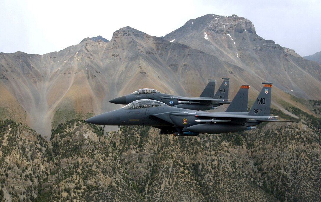 MOUNTAIN HOME AIR FORCE BASE, Idaho -- Two F-15E Strike Eagles perform a low-level training mission over the Sawtooth Mountain Range. The Strike Eagles give the 366th Fighter Wing here sophisticated air-to-ground attack capabilities and air-to-air superiority. They can be equipped with both laser-guided weapons and air-to-air missiles, and use the low-altitude navigation and targeting infrared for night, or LANTIRN system, to find and destroy targets at night in all kinds of weather with precision. (U.S. Air Force photo by Tech. Sgt. Debbie Hernandez)