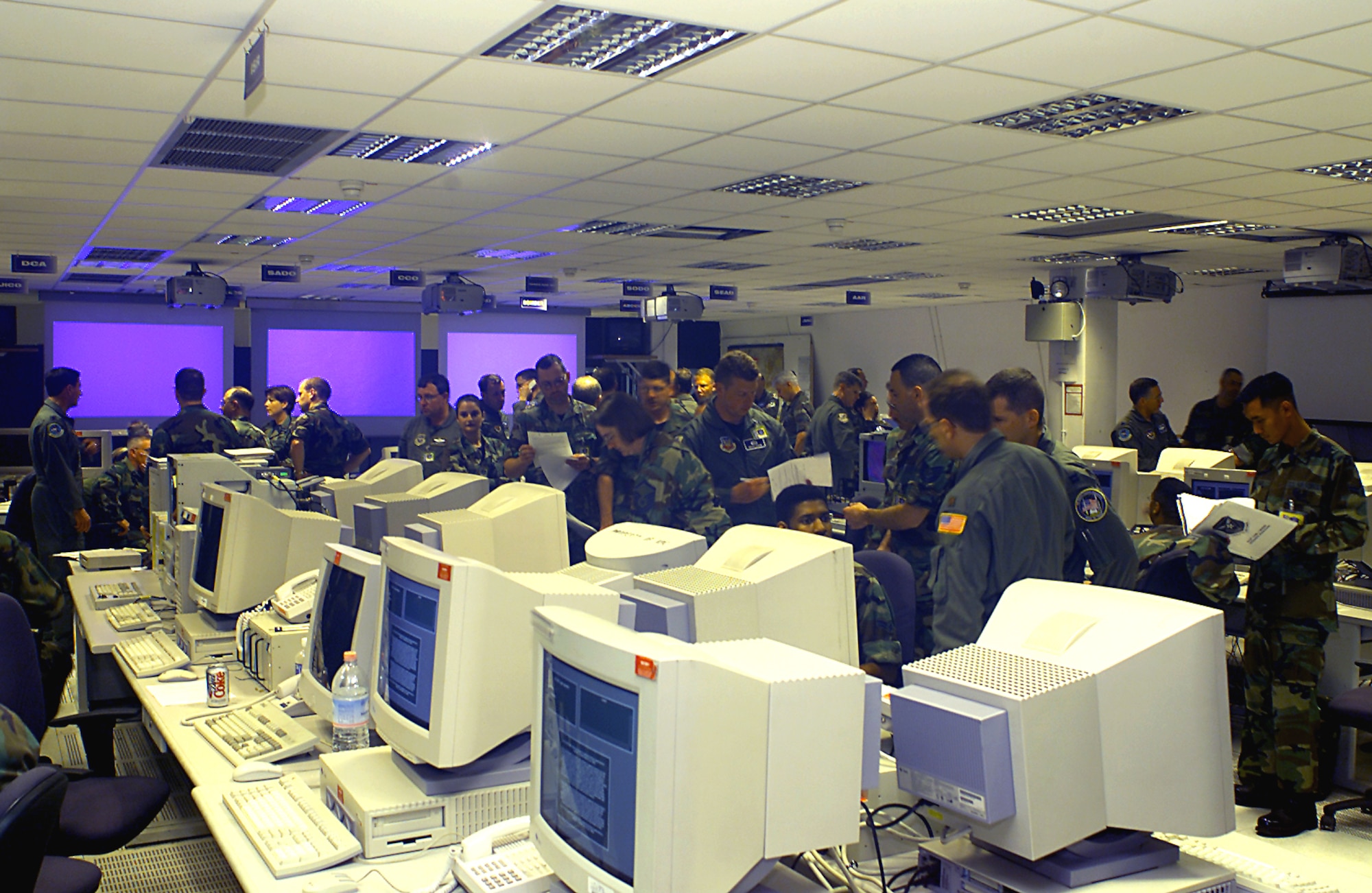 RAMSTEIN AIR BASE, Germany -- Airmen plan and execute the air war in the European Theater inside the air operations center here.  U.S. Air Forces in Europe's 32nd Air Operations Group is deploying more than 90 airmen to Nellis Air Force Base, Nev., to participate in Red Flag 2003 Oct. 19 to 31.  The airmen, from both rated and nonrated specialties, comprise a Falconer AOC, one of five such units in the Air Force.  It is the first of its kind to deploy to Nellis to participate in the Air Force's annual airpower combat training exercise.  (U.S. Air Force photo by Master Sgt. Bill Kimble)