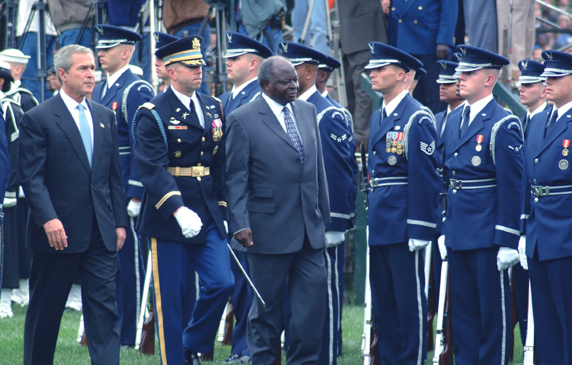 WASHINGTON -- President George W. Bush and Mwai Kibaki, Kenya's head of state, pass in front of the Air Force Honor Guard during an arrival ceremony on the south lawn of the White House recently.  (U.S. Air Force photo by Senior Airman Stacey R. Thomas)