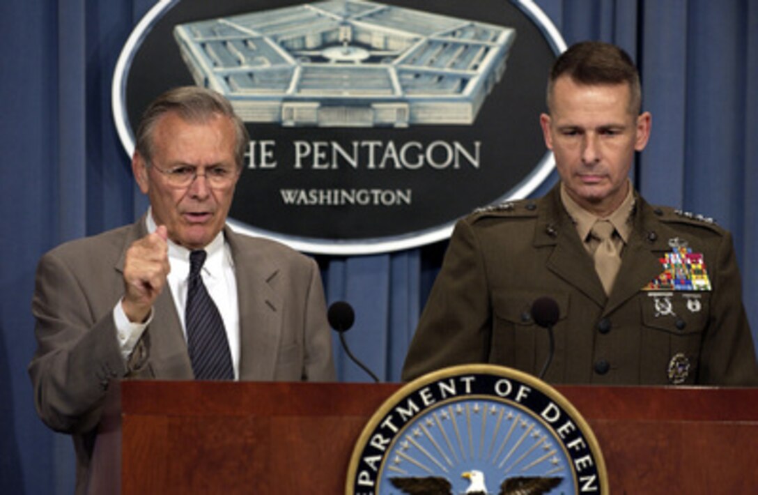 Secretary of Defense Donald H. Rumsfeld tells reporters about security forces in Iraq during a Pentagon press briefing on Oct. 21, 2003. Rumsfeld and Vice Chairman of the Joint Chiefs of Staff Gen. Peter Pace, U.S. Marine Corps, briefed reporters on the progress of the coalition efforts in Iraq. 