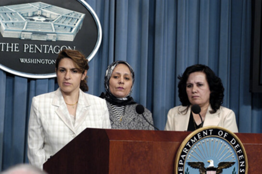 Director of Employment Fatin al-Saeda (left), Director of the Employment and Vocational Training Center Swanson Mahdi (center), and Director Of Information Technology Evelyn Rasho, of the Iraqi Ministry of Labor and Social Affairs, listen to a reporter's question during a Pentagon press briefing on Oct. 22, 2003. The three directors are in Washington to brief decision makers on their roles in the new Iraqi government. 