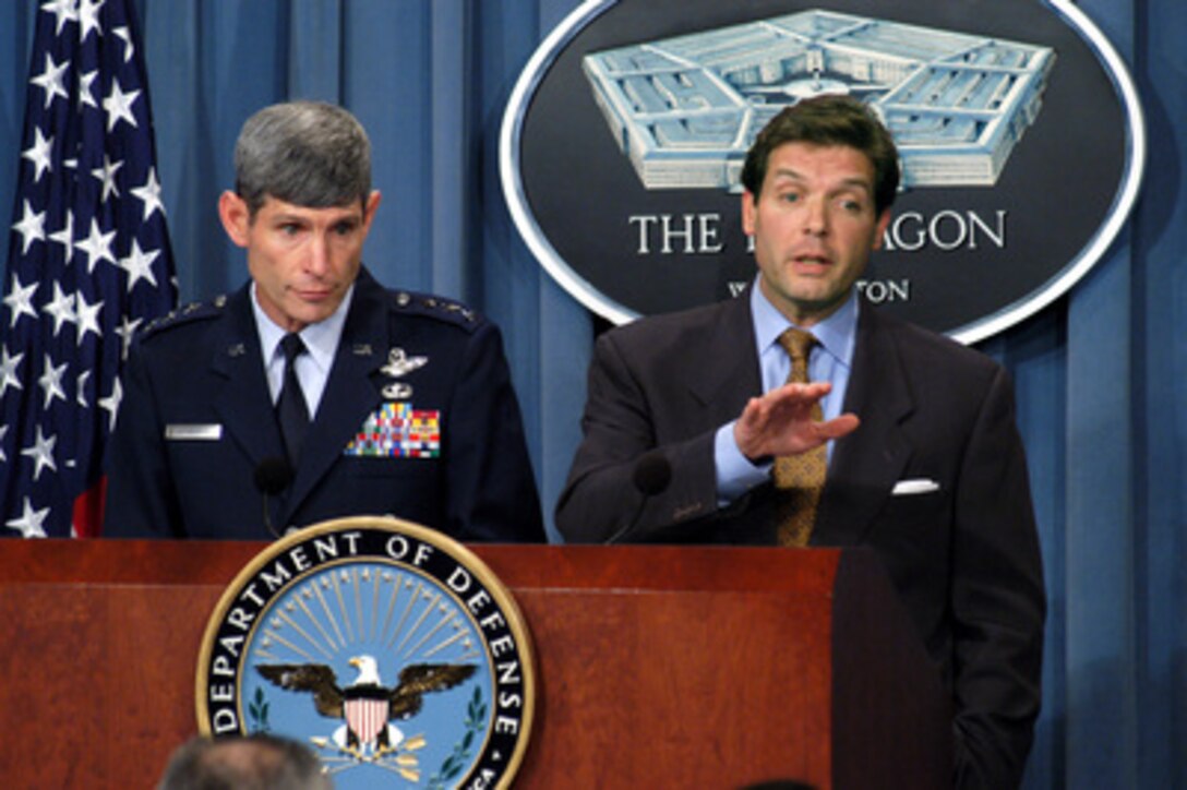 Acting Assistant Secretary of Defense for Public Affairs Lawrence Di Rita (right) responds to a reporter's question about Secretary of Defense Donald H. Rumsfeld's memo concerning the Global War on Terrorism during a Pentagon press briefing on Oct. 23, 2003. Di Rita and Director for Operations of the Joint Staff, J-3, Lt. Gen. Norton Schwartz (left), U.S. Air Force, also provided reporters an operation update on the coalition's progress in Iraq. 