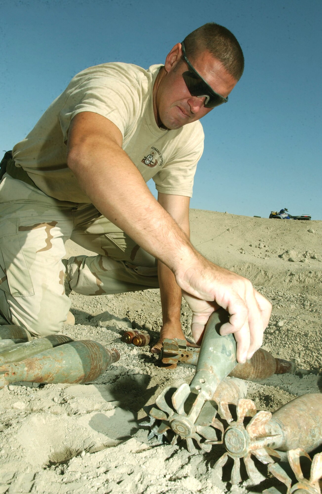TALLIL AIR BASE, Iraq -- Tech. Sgt. David Featherstun lines up Soviet, O-832 DU, 82 mm, high-explosive filled mortars for demolition.  Featherstun is part of the 332nd Expeditionary Civil Engineer Squadron's explosive ordnance disposal flight here.  (U.S. Air Force photo by Senior Airman Karolina Gmyrek)