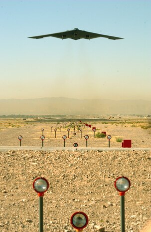 NELLIS AIR FORCE BASE, Nev. -- A B-2 Spirit takes off from the flightline here on a Red Flag training mission, Oct. 23, 2003.  The B-2, a multi-role bomber capable of delivering both conventional and nuclear munitions, brings massive firepower to bear anywhere on the globe. (U.S. Air Force photo by Master Sgt. Michael R. Nixon)