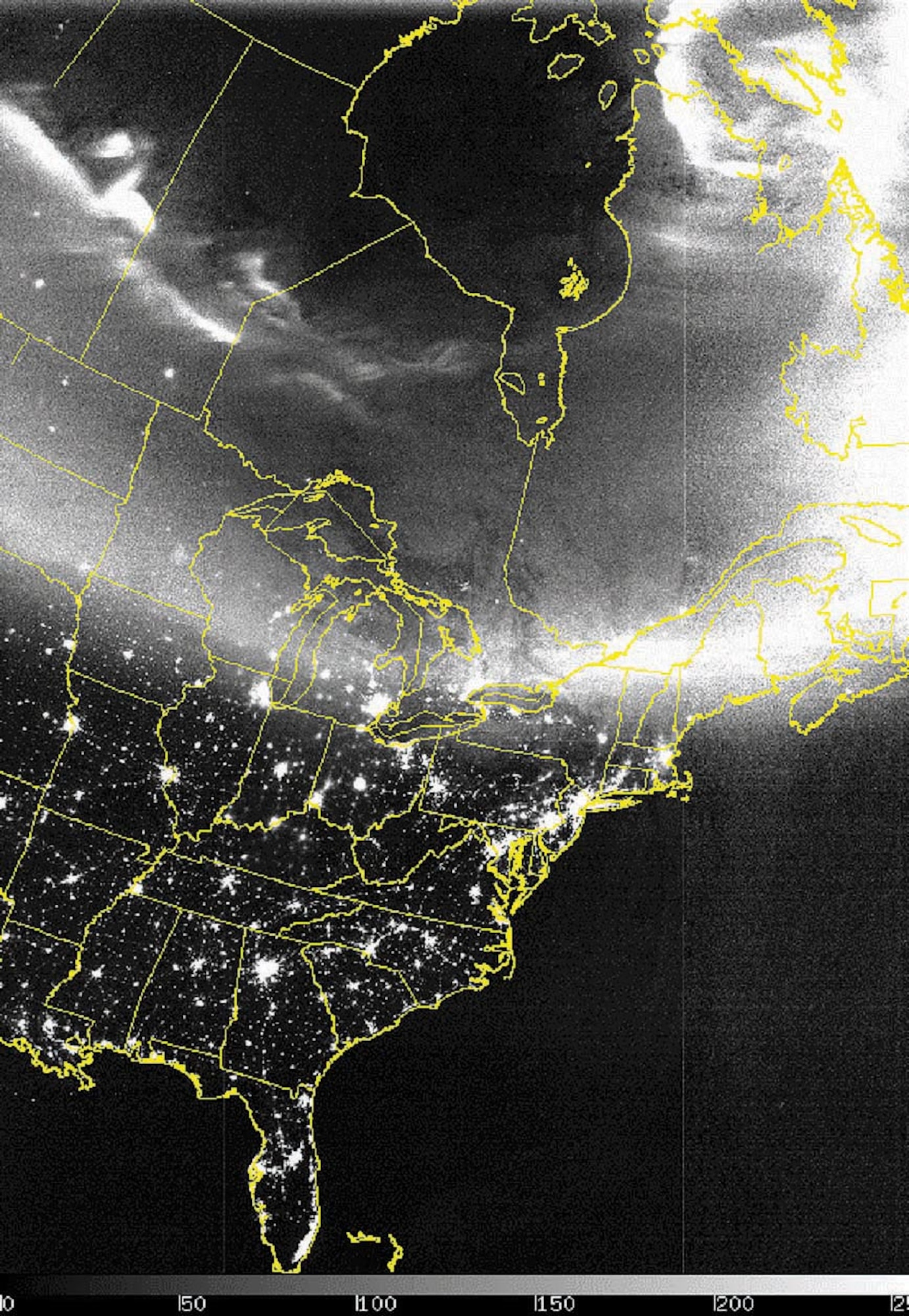 COMPOSITE IMAGE -- This Defense Meteorological Satellite Program satellite network image uses a combination of infrared data with a specialized visual sensor that can see lights at night.  The aurora is seen from the Dakotas through Maine on Oct. 29.  (Courtesy image)