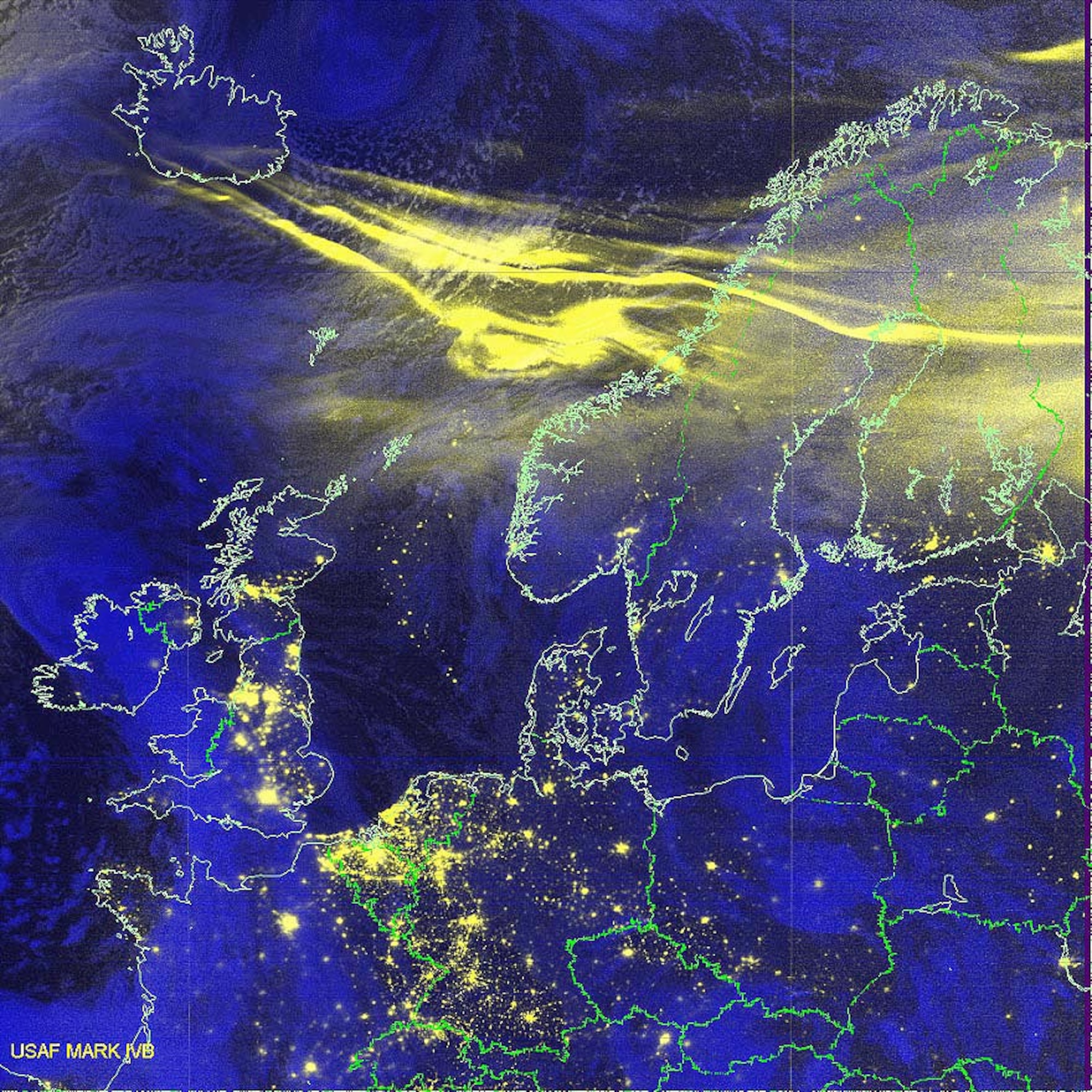 COMPOSITE IMAGE -- This Defense Meteorological Satellite Program satellite network image uses a combination of infrared data with a specialized visual sensor that can see lights at night.  The yellow streak shows a vigorous aurora over Norway and Sweden on Oct. 30. (Courtesy image)