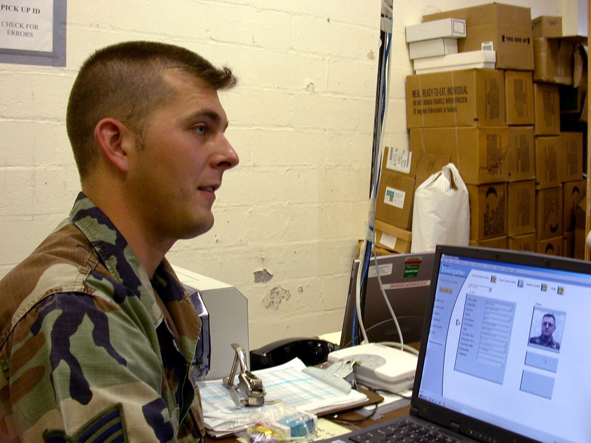 U.S. NAVAL BASE GUANTANAMO BAY, Cuba -- Staff Sgt. Todd Cook is one of a handful of airmen supporting Joint Task Force-Guantanamo.  He is responsible for in-processing all new task force people.  Cook is deployed from Wright-Patterson Air Force Base, Ohio.  (U.S. Air Force photo by Master Sgt. Tammy Cournoyer)
