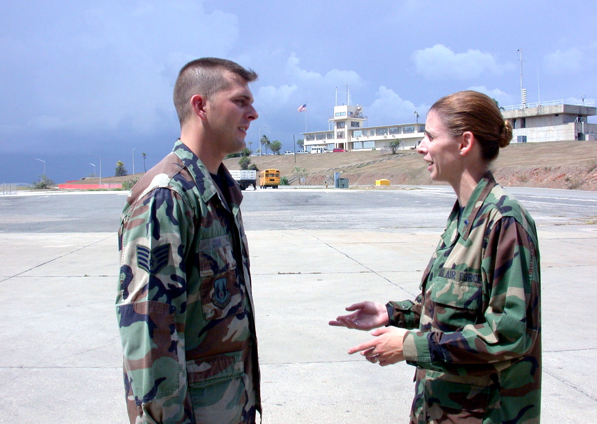 U.S. NAVAL BASE GUANTANAMO BAY, Cuba -- Staff Sgt. Todd Cook (left) and 1st Lt. Audra Lyons are two of a handful of airmen supporting Joint Task Force-Guantanamo.  Both are deployed from Wright-Patterson Air Force Base, Ohio., and work in the Joint Personnel Reception Center here.  (U.S. Air Force photo by Master Sgt. Tammy Cournoyer)