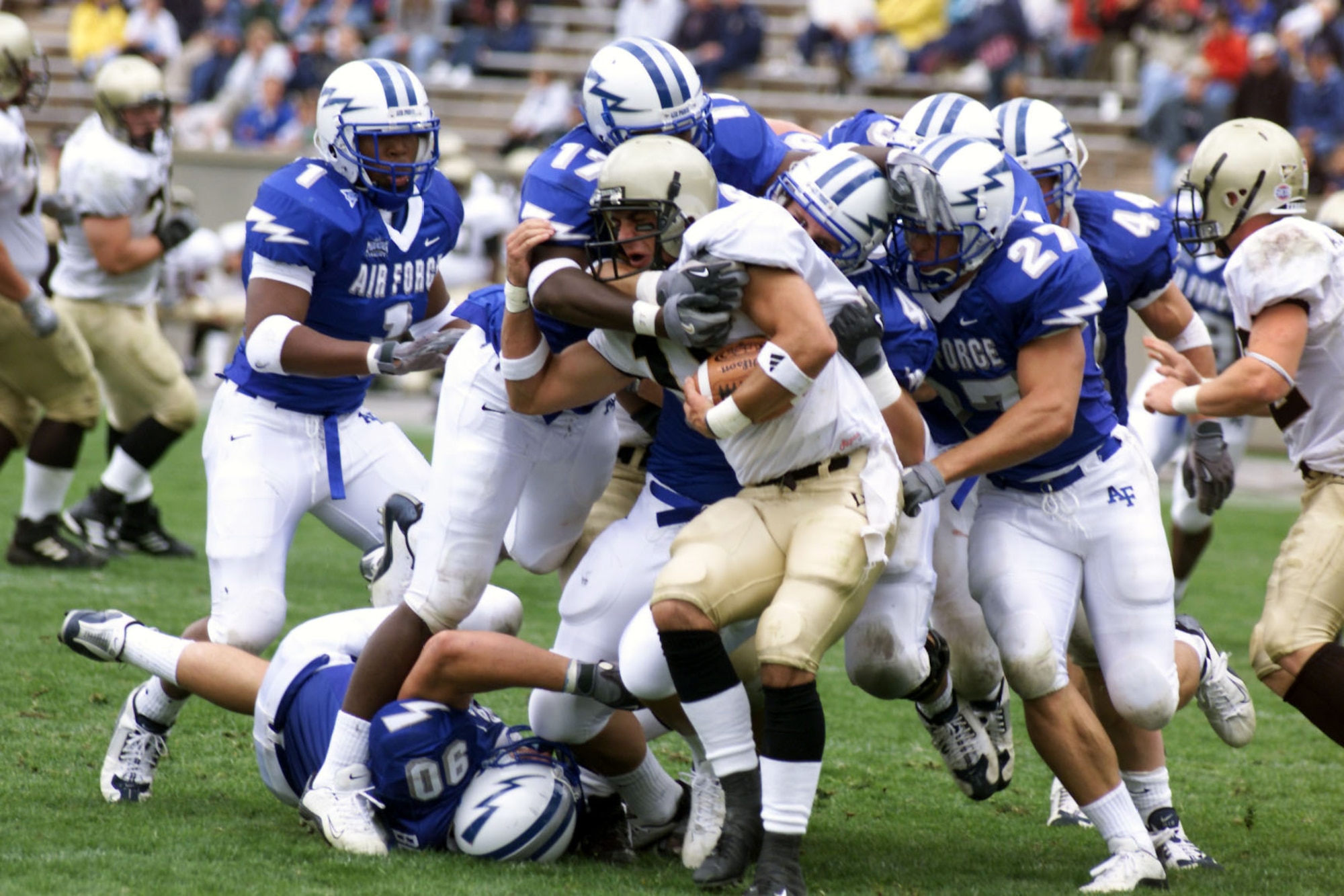 U.S. AIR FORCE ACADEMY, Colo. -- Wofford College quarterback Jeff Zolman finds himself buried in a blue wave of Falcon defenders.  The Air Force Academy Falcons shut out Wofford, 49-0, Aug. 30.  (U.S. Air Force photo by John Van Winkle)