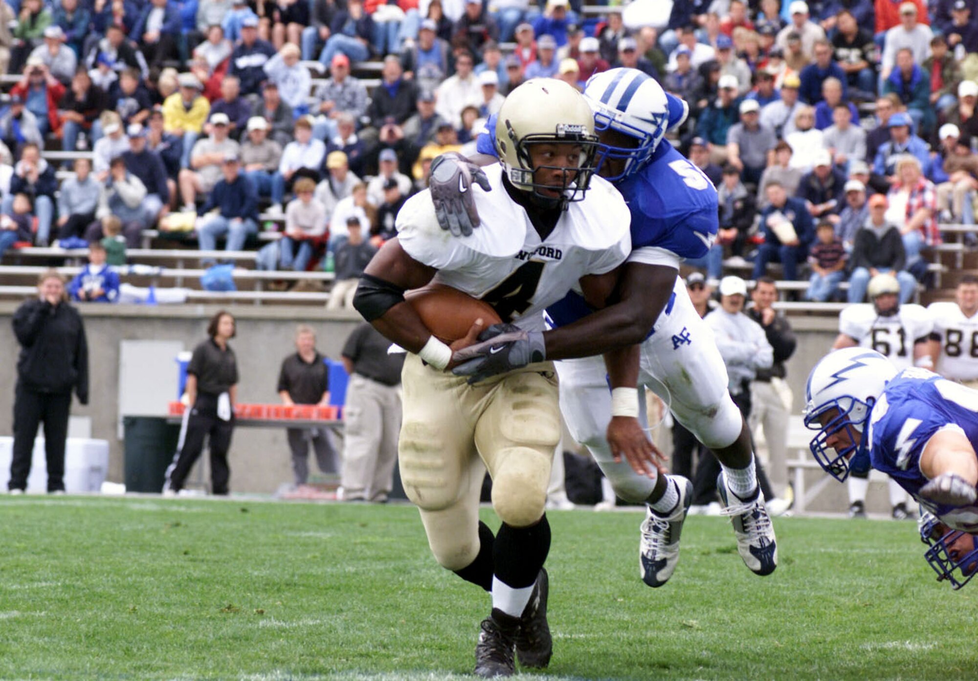 U.S. AIR FORCE ACADEMY, Colo. -- Air Force Academy Falcon linebacker Marchello Graddy goes airborne to wrap up Wofford fullback J.R. McNair.  The Falcons shut out Wofford, 49-0, during the teams' Aug. 30 game.  (U.S. Air Force photo by John Van Winkle)