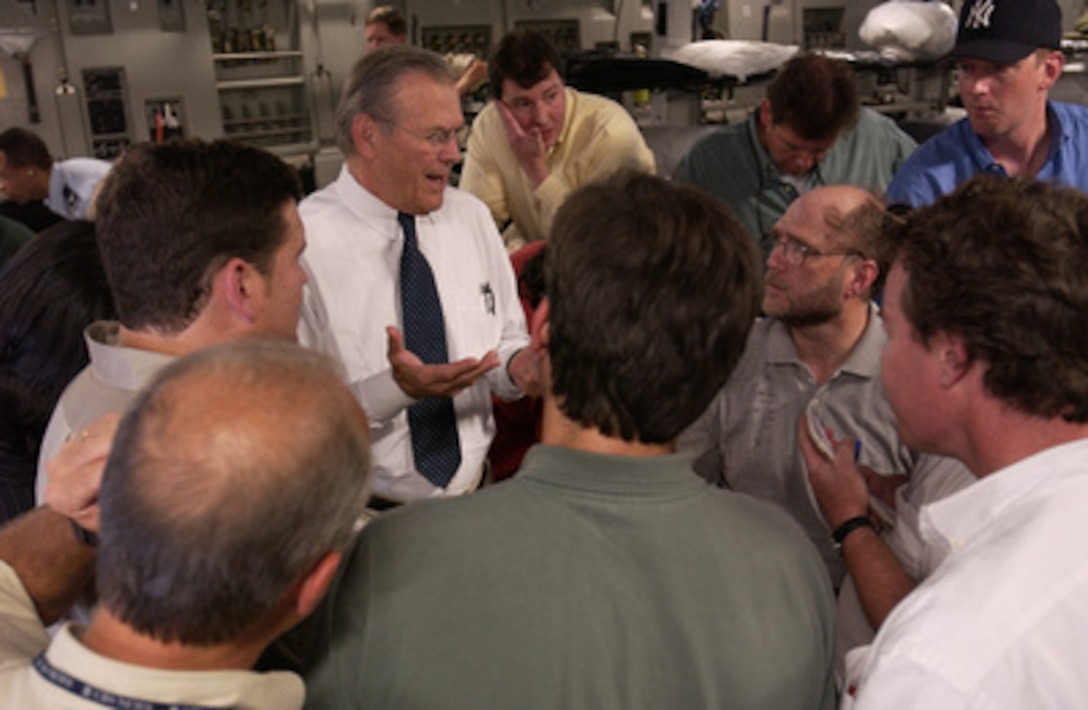 Secretary of Defense Donald H. Rumsfeld answers the questions of press traveling with him prior to arriving in Iraq on Sept. 3, 2003. 