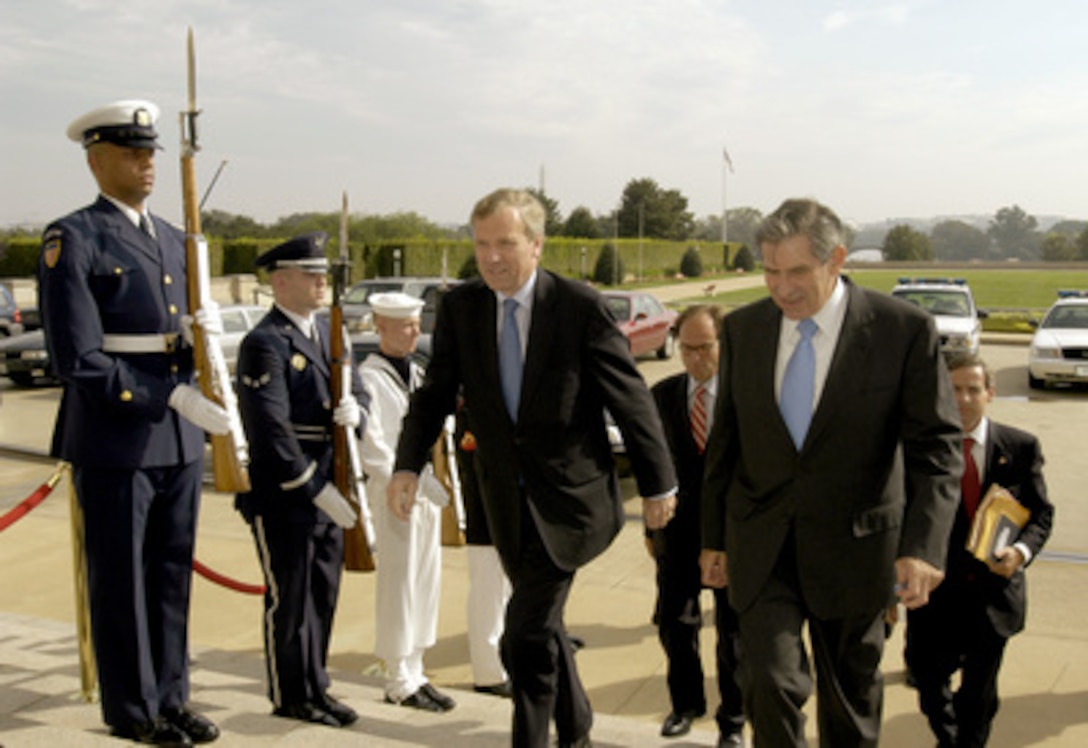 Dutch Minister of Foreign Affairs Jaap de Hoop Scheffer (left) is escorted into the Pentagon by Deputy Secretary of Defense Paul Wolfowitz (right) on Sept. 2, 2003. Scheffer and Wolfowitz will meet to discuss a range of security issues of interest to both nations. 