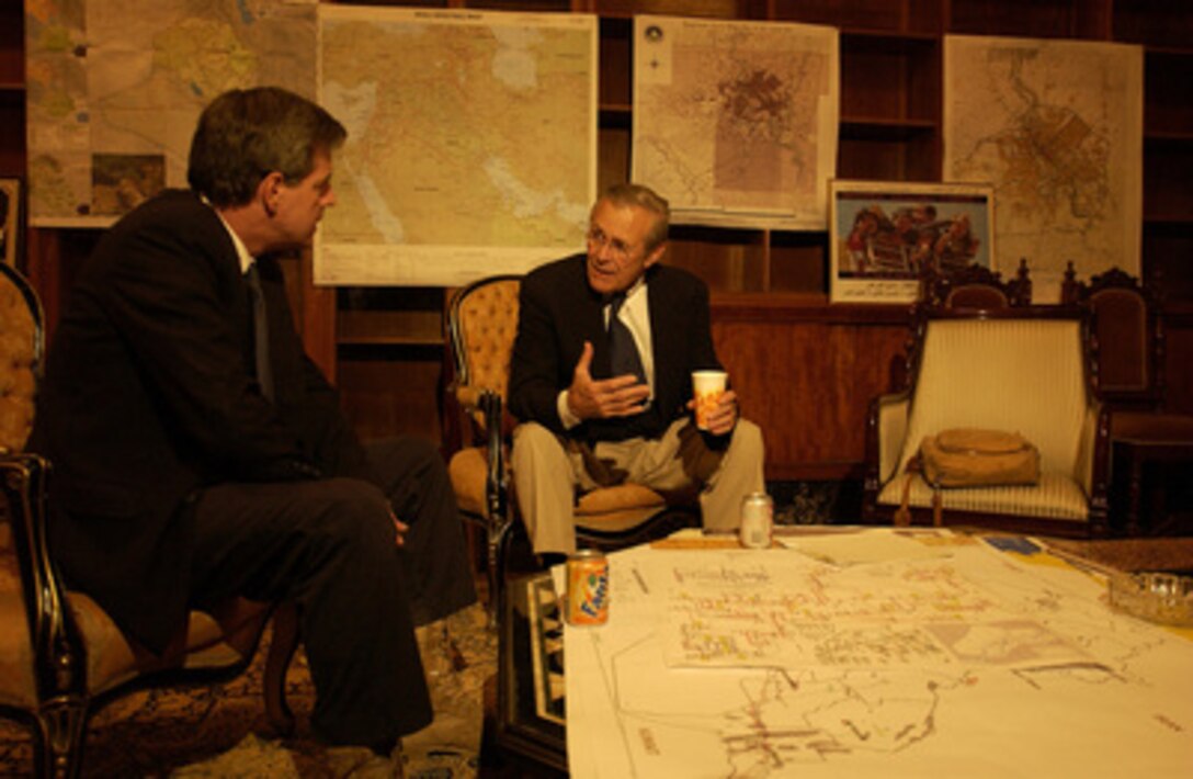 Secretary of Defense Donald H. Rumsfeld is briefed by Ambassador Paul Bremer in Iraq on Sept. 4, 2003. 