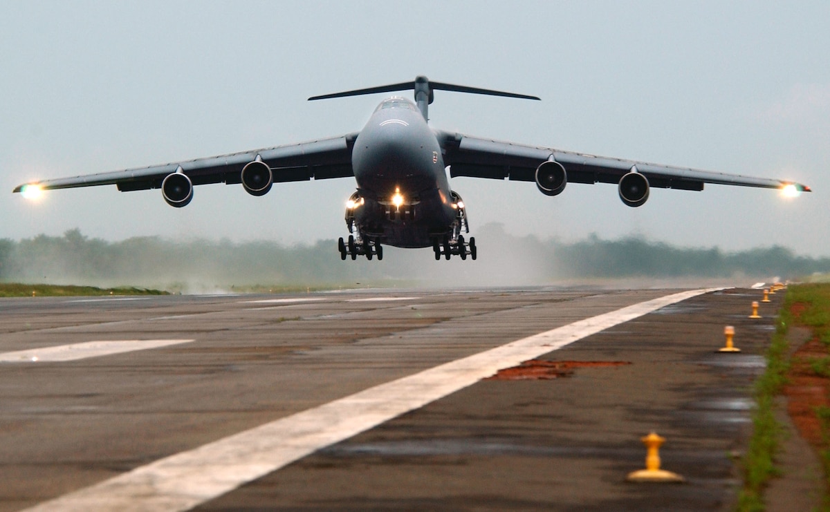 LUNGI, Sierra Leone -- A C-5 Galaxy, with the 301st Airlift Squadron, Travis Air Force Base, Calif., departs for Naval Air Station Keflavik, Iceland, carrying 398th Air Expeditionary Group personnel and equipment that have been supporting efforts in Liberia.  (U.S. Air Force photo by Tech. Sgt. Justin D. Pyle)