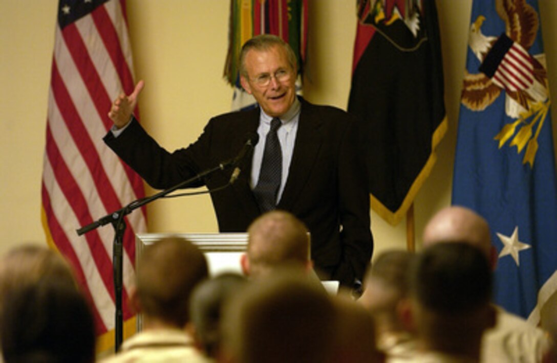 Secretary of Defense Donald H. Rumsfeld answers a question from a member of the audience during a town hall meeting with the troops of the 101st Airborne Division at Mosul, Iraq, on Sept. 5, 2003. 