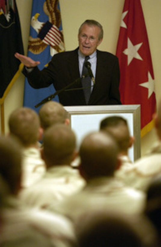 Secretary of Defense Donald H. Rumsfeld answers a question from a member of the audience during a town hall meeting with the troops of the 101st Airborne Division in Mosul, Iraq, on Sept. 5, 2003. 