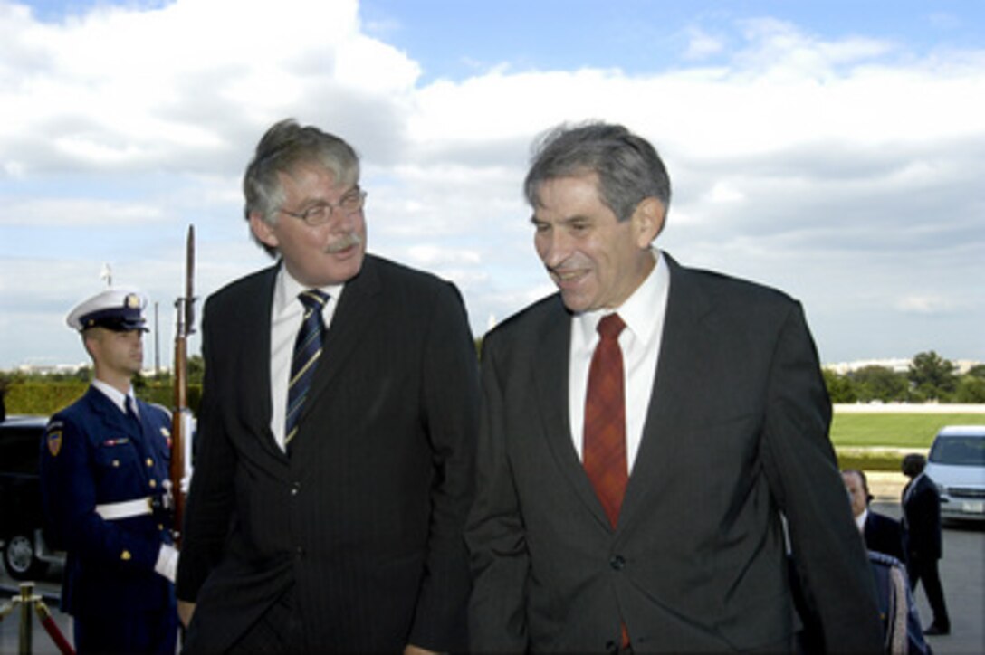 Deputy Secretary of Defense Paul Wolfowitz (right) escorts Netherlands State Secretary for Defense Cees van der Knaap into the Pentagon on Sept. 5, 2003. The two defense leaders will hold talks on a broad range of bilateral security issues. 