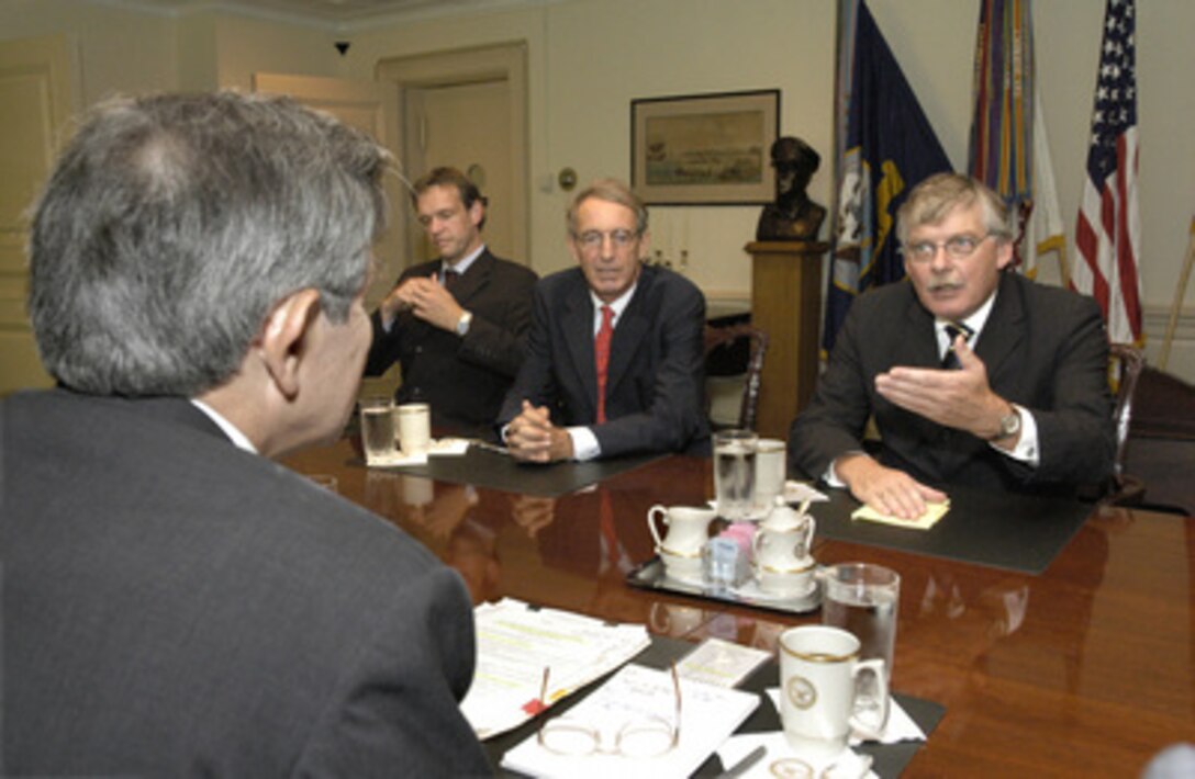 Netherlands State Secretary for Defense Cees van der Knaap (right) meets with Deputy Secretary of Defense Paul Wolfowitz (left foreground) at the Pentagon on Sept. 5, 2003, to discuss a broad range of bilateral security issues. Also participating in the talks, on the Dutch side, are Ambassador Boudewijn van Eenennaam (center) and Wim Bargerbos (left), of the defense policy directorate. 