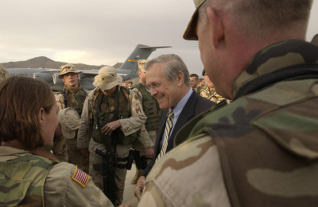 Secretary of Defense Donald H. Rumsfeld talks to the troops prior to departing Kabul, Afghanistan, on Sept. 7, 2003. 