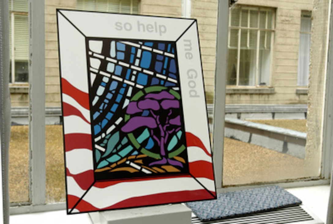 On display at the Pentagon, on September 4, 2003, is a miniature representation of one of the four stained glass panels that will be installed in the Pentagon Chapel in memory of the 184 victims of the September 11, 2001, terrorist attack. Secretary of Defense Donald H. Rumsfeld will dedicate the windows in a ceremony on the second anniversary of the attack. 