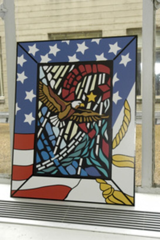 On display at the Pentagon, on September 4, 2003, is a miniature representation of one of the four stained glass panels that will be installed in the Pentagon Chapel in memory of the 184 victims of the September 11, 2001, terrorist attack. Secretary of Defense Donald H. Rumsfeld will dedicate the windows in a ceremony on the second anniversary of the attack. 