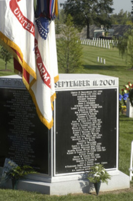 The five-sided memorial to the victims of the September 11, 2001, terrorist attack on the Pentagon is located in section 64 of Arlington National Cemetery. Appearing in silver raised letters are the names of the 184 victims of the attack. The Patriot's Day wreath laying ceremony marked the second anniversary of the attack. On this occasion, Secretary of Defense Donald H. Rumsfeld and Chairman of the Joint Chiefs of Staff Gen. Richard B. Myers placed a memorial wreath at the monument in memory of the victims. 