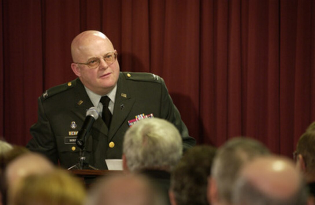 Pentagon Chaplain Col. Ralph G. Benson welcomes the attendees to the Pentagon Chapel on Sept. 11, 2003. A ceremony was held to dedicate new stained glass windows to the memory of those who died in the Pentagon on Sept. 11, 2001. 