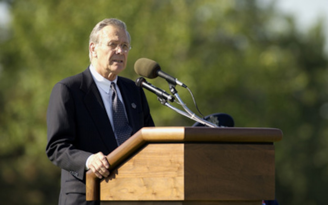 Secretary of Defense Donald H. Rumsfeld speaks to the attendees at the Patriot's Day observance on Sept. 11, 2003, at Arlington National Cemetery. 