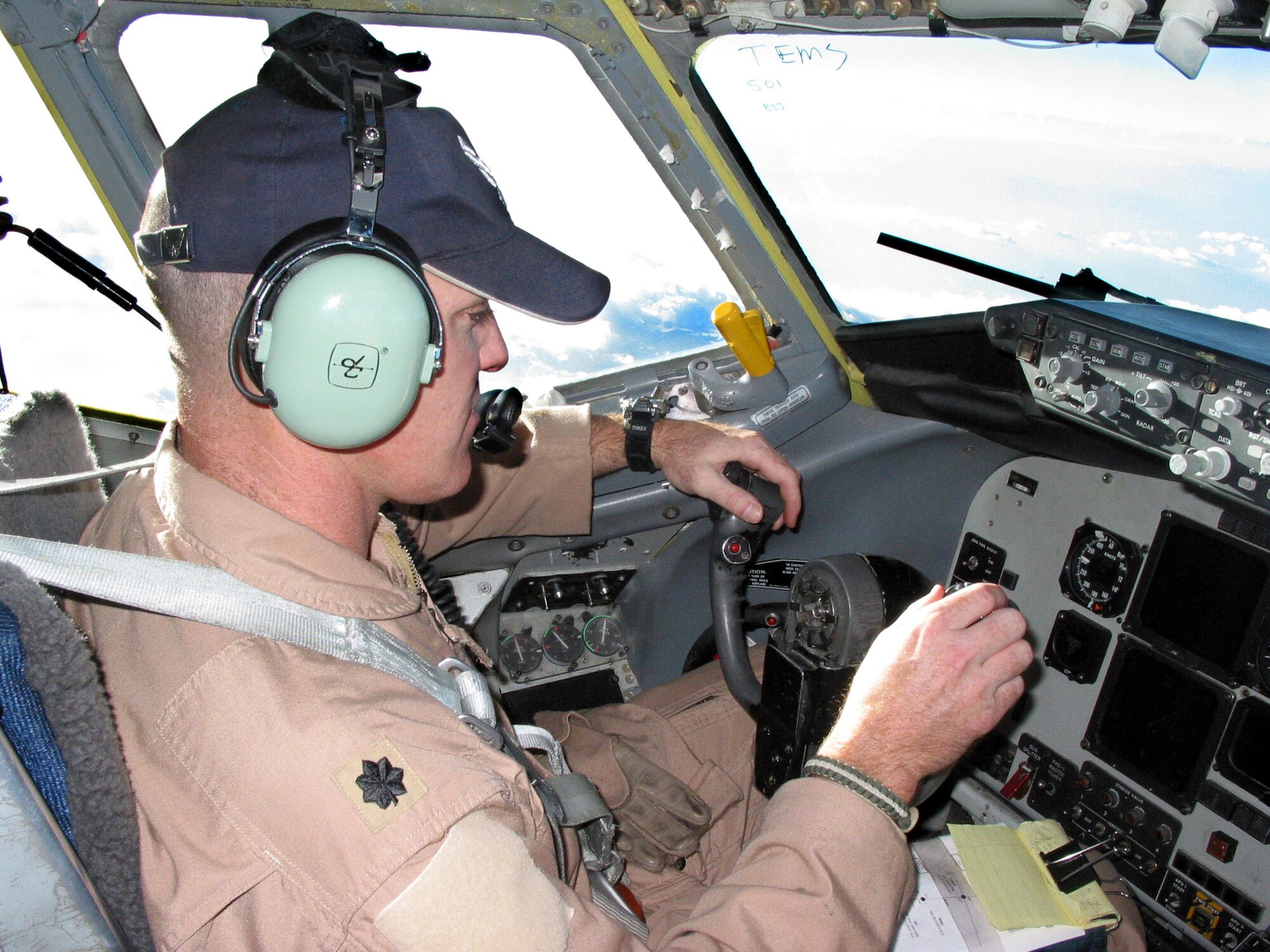 GANCI AIR BASE, Kyrgyzstan -- Lt. Col. Murph Clark flies a KC-135 Stratotanker on a combat mission over Afghanistan on Sept. 11.  Clark has flown on Sept. 11 each year since 2001.  He responded to the terrorist attacks in 2001 by flying over Alaska from Eielson Air Force Base.  Clark is the commander of the 22nd Expeditionary Air Refueling Squadron here.  (U.S. Air Force photo by Capt. Allen Herritage)