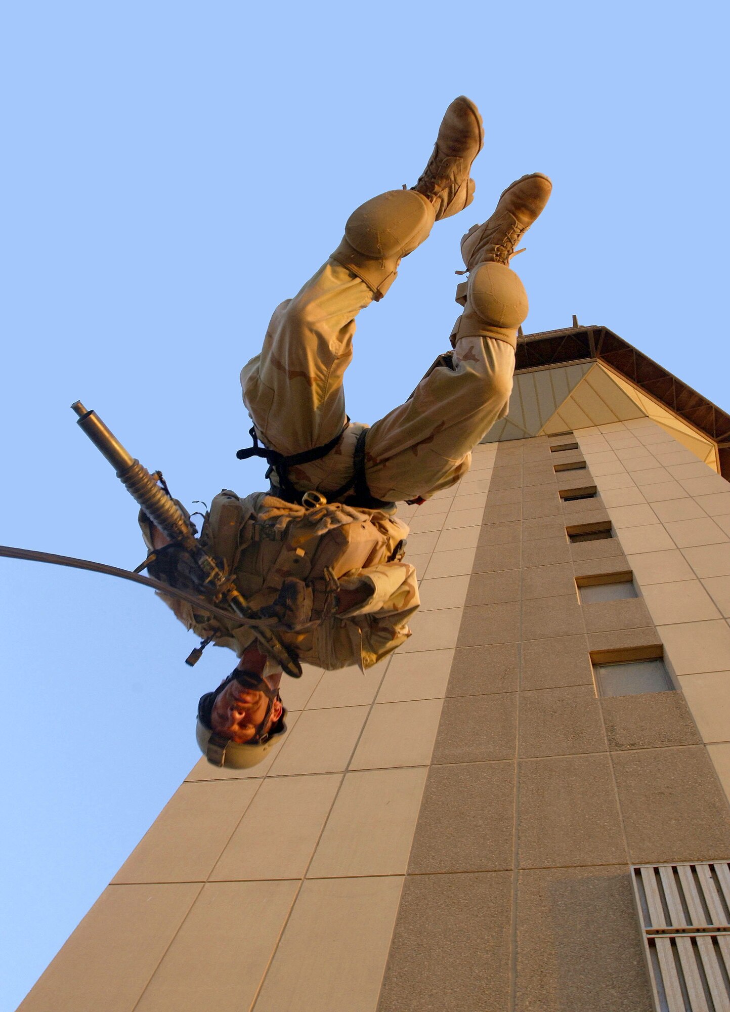 BAGHDAD, Iraq -- Senior Master Sgt. Matt Ramp, an Air Force Reserve pararescueman assigned to the 304th Rescue Squadron, Portland International Airport, performs a rappelling exercise from the Baghdad International Airport air traffic control tower. Members of the 304th Rescue Squadron are deployed to Baghdad International Airport supporting Operation Iraqi Freedom. (U.S. Air Force photo by Master Sgt. James M. Bowman)