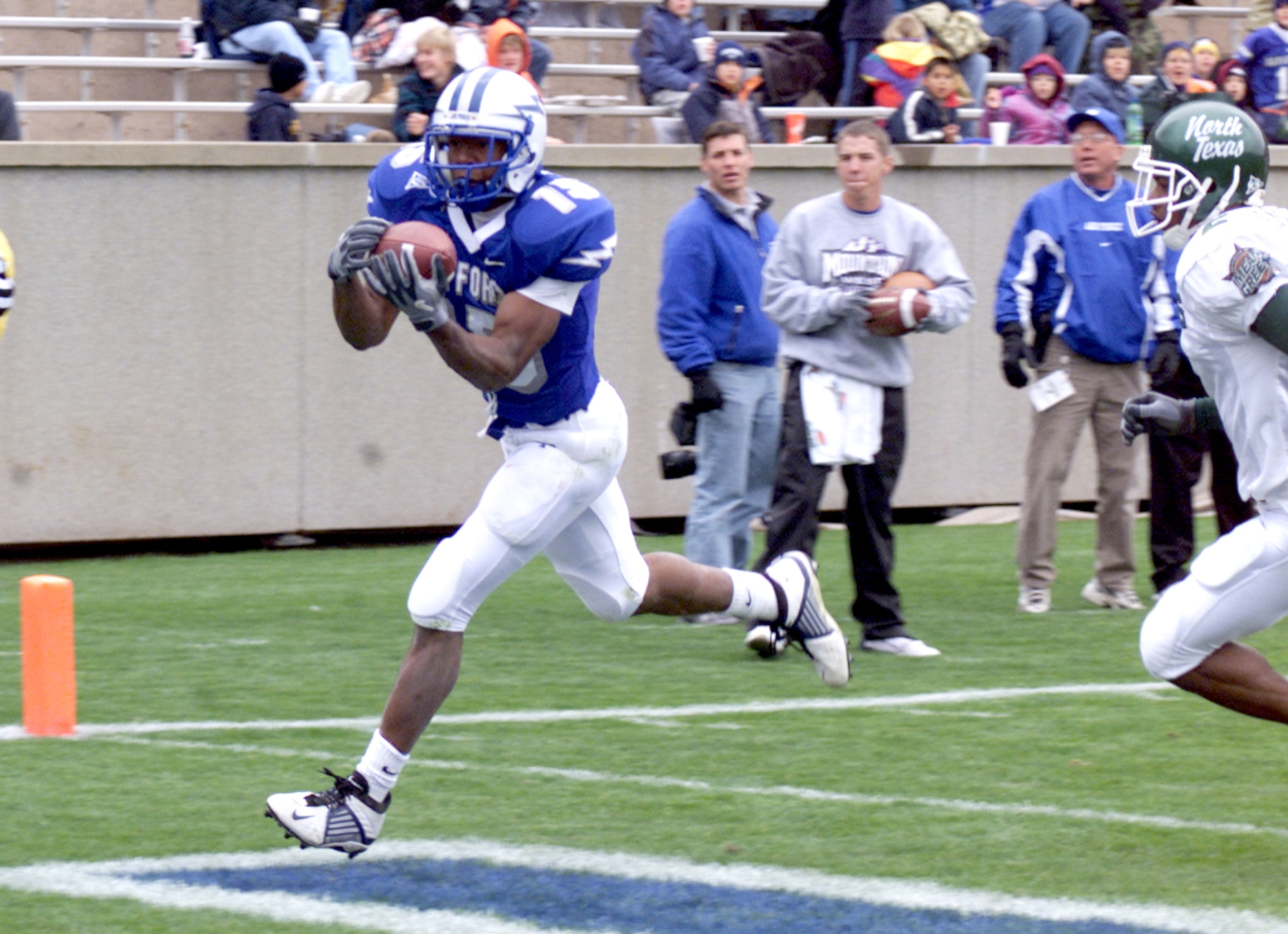 U.S. AIR FORCE ACADEMY, Colo. -- Air Force halfback Darnell Stephens tucks the ball after an 18-yard touchdown reception during the Air Force Academy Falcon's 34-21 win over the University of North Texas on Sept. 13.  The Falcon's added 156 passing yards and three touchdown receptions to their nationally ranked rushing attack, to notch their third win of the season.  The Falcons meet the University of Wyoming Cowboys on Sept. 20 at Falcon Stadium.  (U.S. Air Force photo by John Van Winkle)