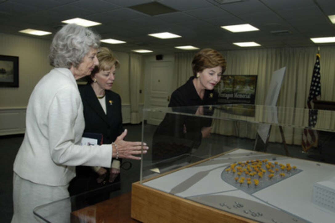Mrs. Joyce Rumsfeld (left) shows the model of the Pentagon Memorial to Mrs. Lynn Cheney (center) and First Lady Laura Bush during their visit to the Pentagon Sept. 11, 2003. 