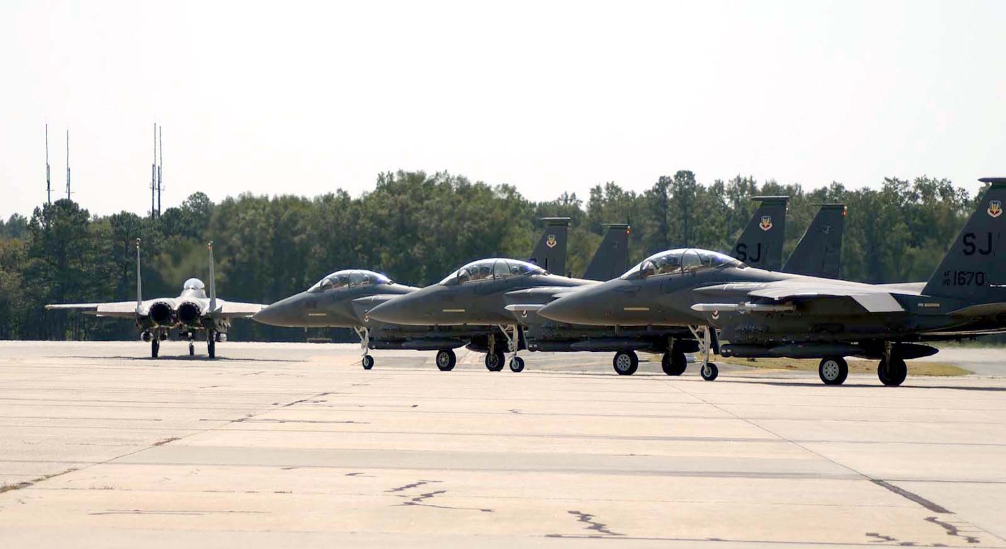 SEYMOUR JOHNSON AIR FORCE BASE, N.C. -- Four F-15E Strike Eagles from the 4th Fighter Wing here taxi out Sept 16.  They are being flown to Tinker Air Force Base, Okla., in preparation from the arrival of Hurricane Isabel.  (Courtesy photo)
