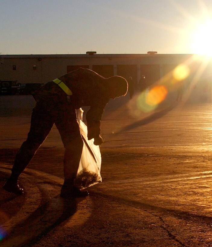 ELLSWORTH AIR FORCE BASE, S.D. -- A member of the 28th Mission Support Group helps clean the flightline of foreign objects that could damage aircraft.  (U.S. Air Force photo by  Airman 1st Class Michael Keller)