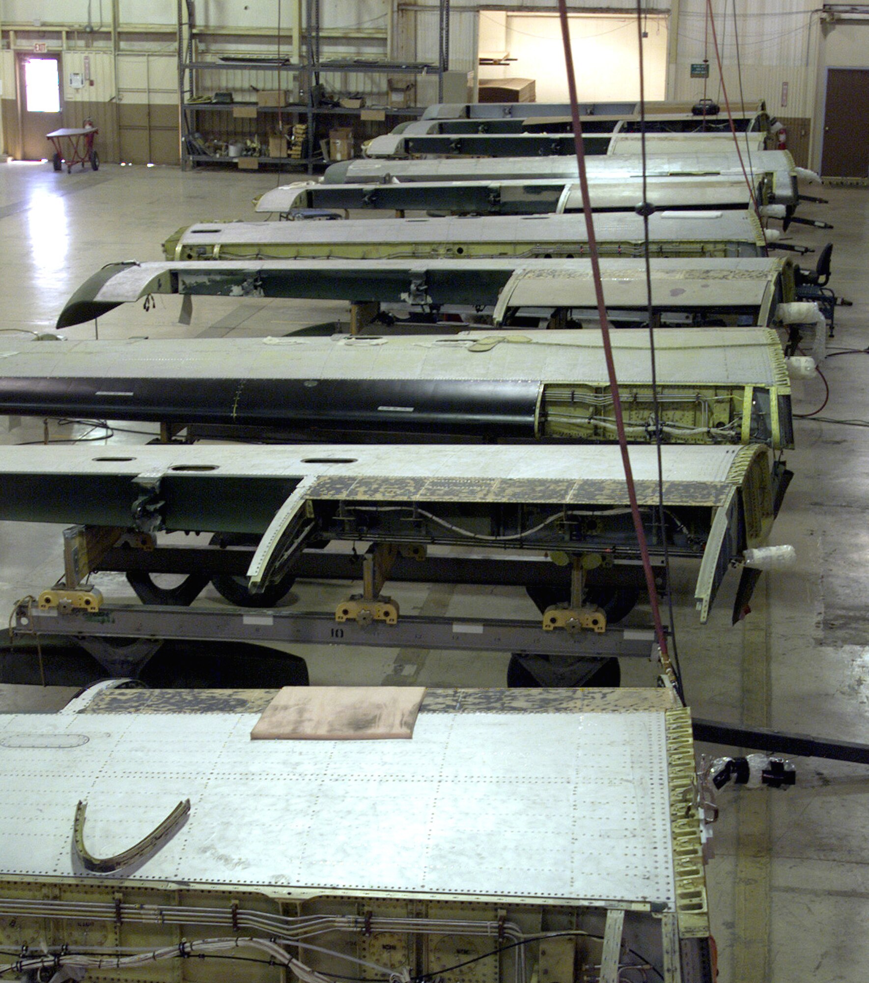 DAVIS-MONTHAN AIR FORCE BASE, Ariz. -- A-10 Thunderbolt II wings undergo inspection and modification by Aerospace Maintenance and Regeneration Center technicians here.  The "Hog Up" program is designed to extend the flying lifespan of the aircraft by inspecting and overhauling the wings.  (U.S. Air Force photo by 2nd Lt. Daniel King)