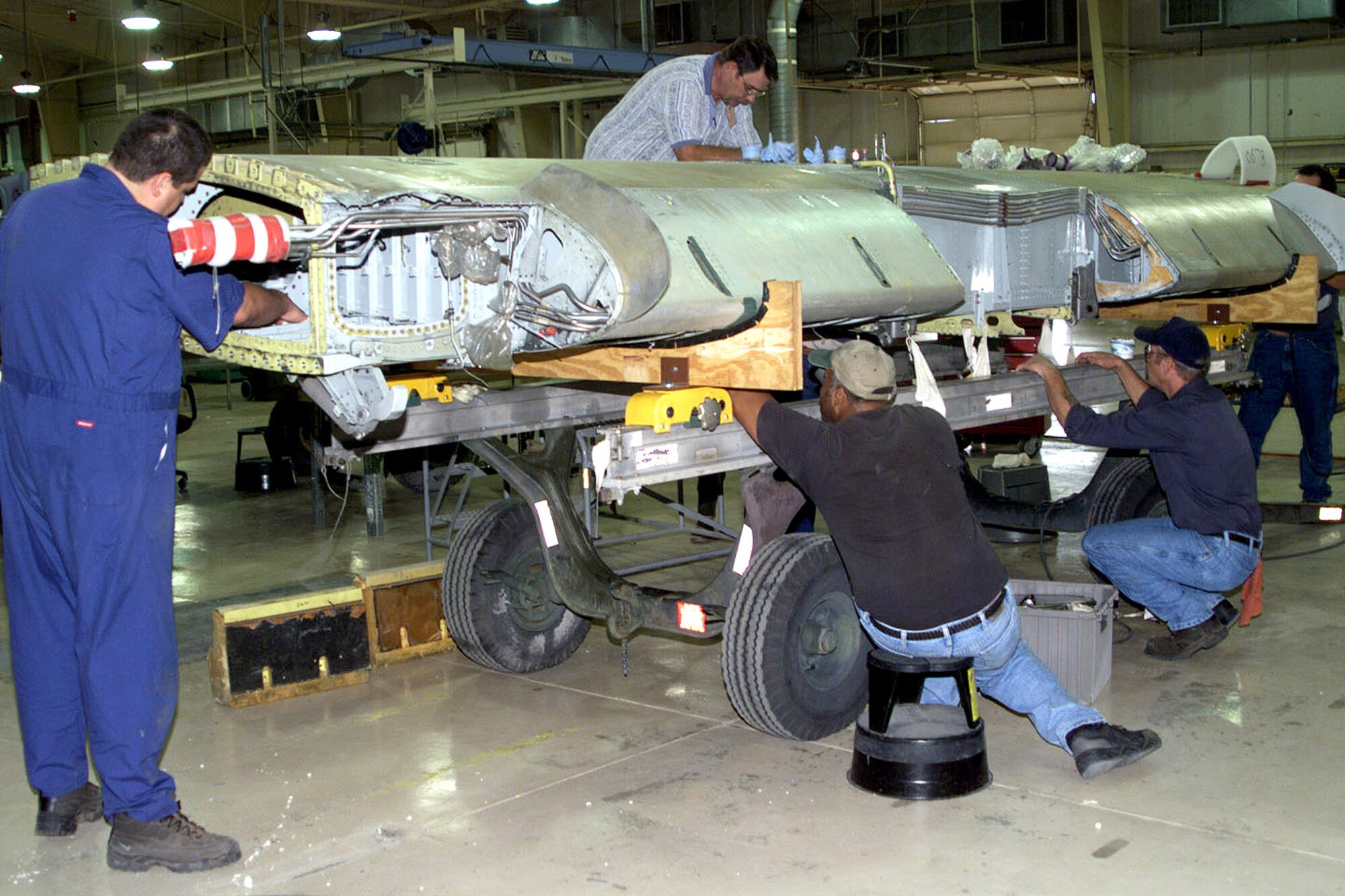 DAVIS-MONTHAN AIR FORCE BASE, Ariz. -- Aerospace Maintenance and Regeneration Center technicians here inspect and modify the internal and external structure of an A-10 Thunderbolt II wing.  The rejuvenated wings help to extend the flying lifespan of the aircraft.  (U.S. Air Force photo by 2nd Lt. Daniel King)